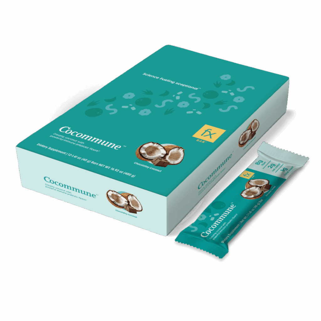 A box of chocolate covered peanuts on top of a green background.